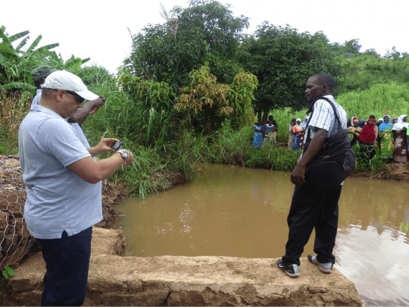 Brother Ashraf Patel - Representative of Peace and Relief International inspecting the main intake area that shares water to both Nakawale and Pachibale irrigation schemes.